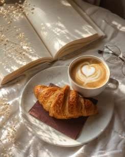 AI render: croissant and a latte beside an open book