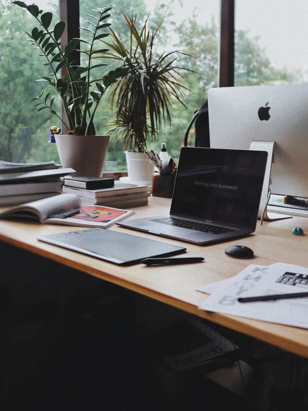 Laptop and notes on an office desk