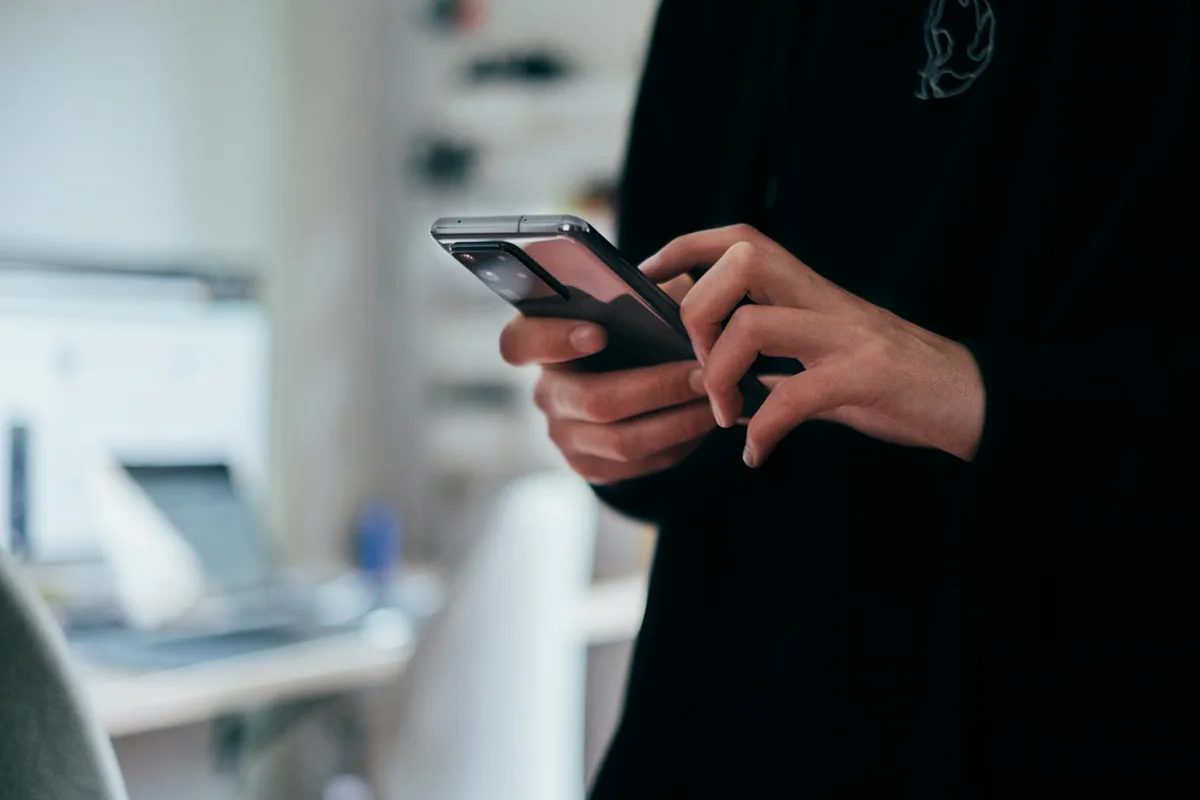 Checking a business's social feed on a phone