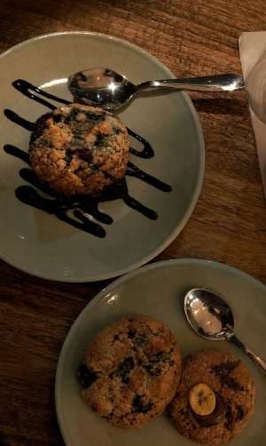 AI render: cookies with chocolate drizzle on a rustic wooden table